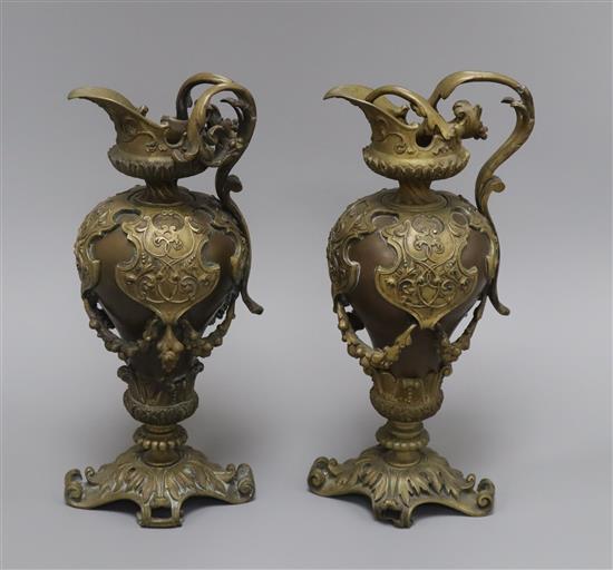 A pair of 20th century Florentine style bronze ewers height 30cm